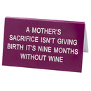 Duży znak na biurko „Powiedz jaki”.