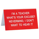 Duży znak na biurko „Powiedz jaki”.